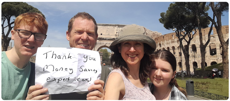 A photo of MoneySaver Simon and his family on holiday in Rome, with the Colosseum in the background. Simon holds a handwritten note saying: "Thank you MoneySavingExpert.com!" Image links to our guide titled Can you make £1,000s by repeatedly switching bank?